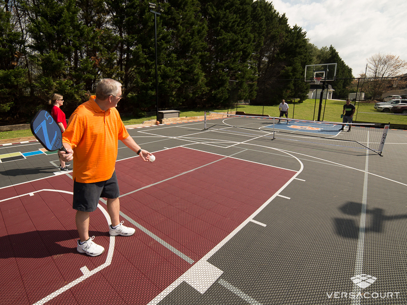 VersaCourt pickleball court beside a house
